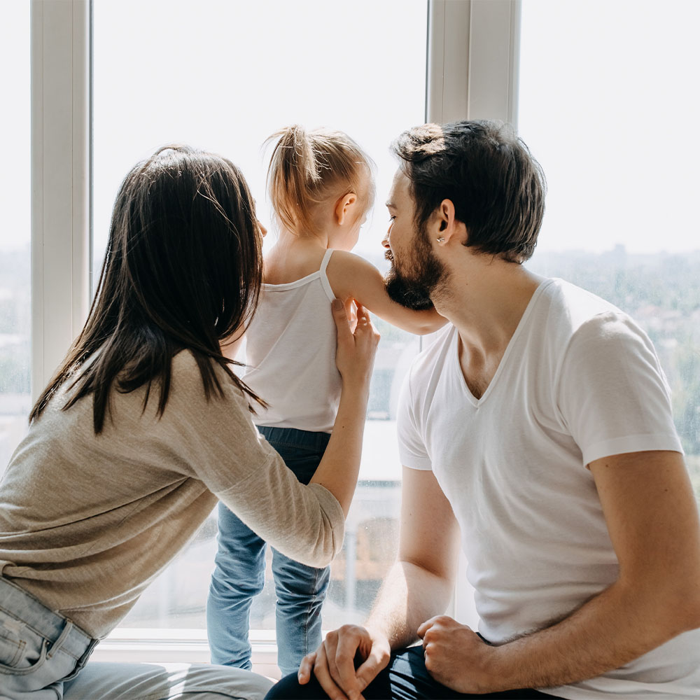 Vida_0003_mother-father-daughter-playing-together-home